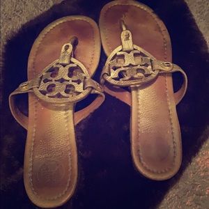 Gold Tory Burch sandals.